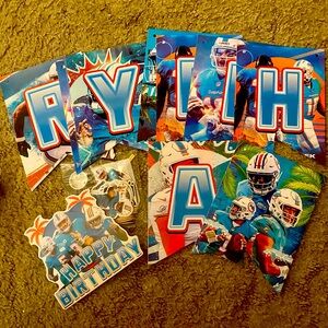 Miami Dolphins Football Birthday Banner and swirling decorations